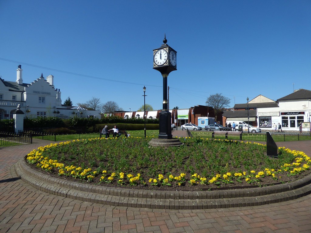 Hednesford town centre, with the town clock in front of the Anglesey Lodge